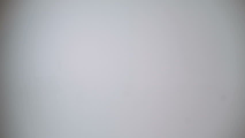 Bearded man in kimono shows funny karate gestures.