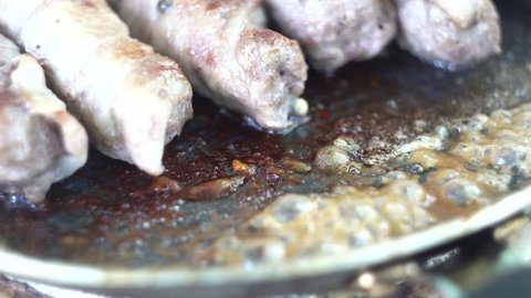 Preparation of meat dish from minced meat wrapped in bacon with white veins. Macro