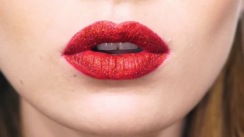 Cropped view of happy woman with red shiny lipstick saying wow and making kiss to camera