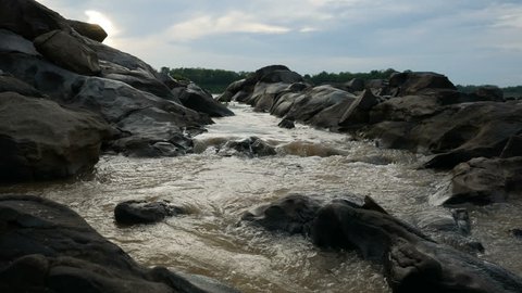water flowing through the stone on a Mekong river stream