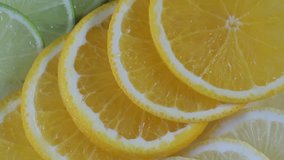 Fresh citrus fruits. Rotation Video footage of the concept of healthy eating and diet. Spinning sliced oranges, lime, lemon,