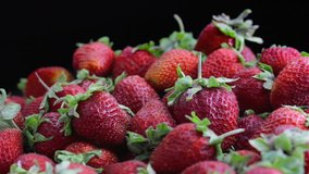 Fresh, ripe, juicy strawberries rotate. Red strawberries clockwise rotation, close-up. Strawberry background.