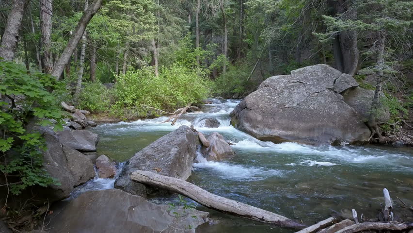 Flying through trees and over the American Fork River in Utah.