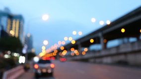 Abstract background image of circular bokeh motion lens blur background of city and street light, traffic light or Bokeh light from car in street in night time. Bangkok Expressway Thailand.