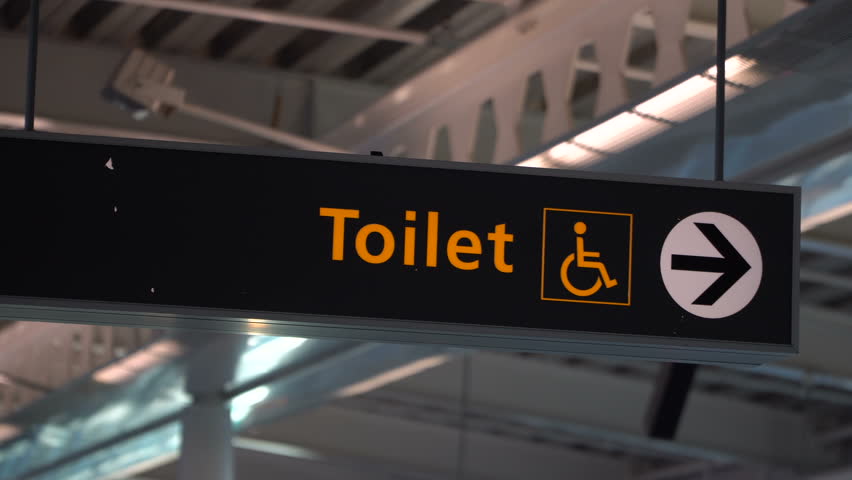 Public restroom signs with a disabled access symbol Royalty-Free Stock Footage #1012492793
