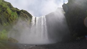 Amazing view of powerful Skogafoss waterfall. Location Skoga river, Iceland, Europe. Scenic footage of beautiful nature landscape. Discover beauty of earth. Full HD 1080 video. Slow motion 120 fps.