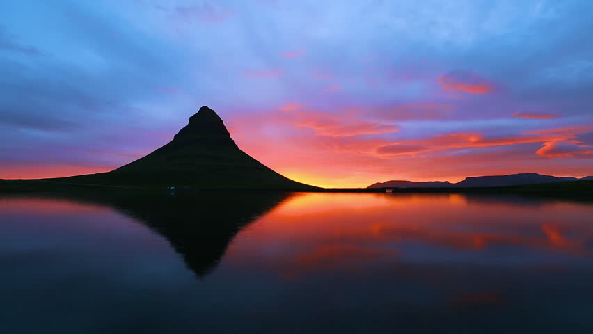 Amazing footage of sunrise over the Atlantic ocean. Location Kirkjufell mountains, Iceland, Europe. Beautiful nature landscape. Discover the beauty of earth. Full HD 1080 video (High Definition). Royalty-Free Stock Footage #1012538126