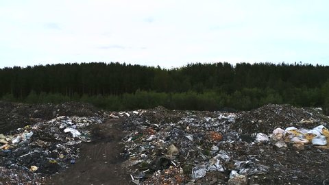 KANDALAKSHA, RUSSIA - JUNE 07, 2018: Environmental Pollution. Illegal Outdoor Garbage Dump Aerial View