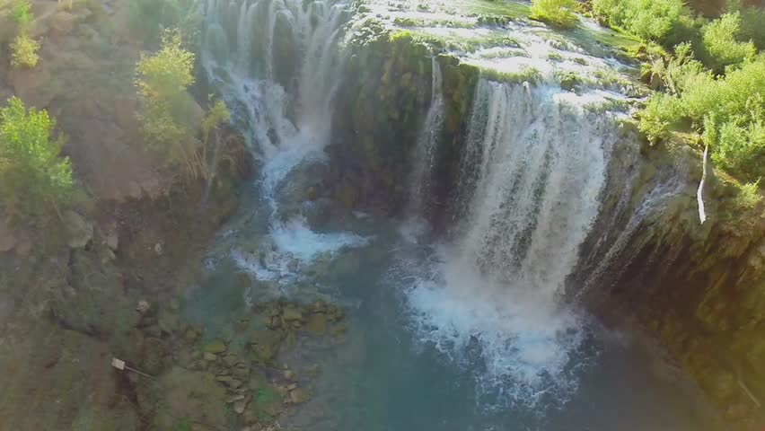 Waterfall and water stream in Grand Canyon at autumn sunny day. Aerial view in timelapse