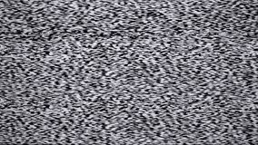 Static tv noise caused by bad signal reception, black and white.