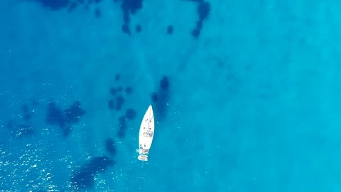 Aerial view on boat in blue colorfull sea with nice waves Scilla Italy