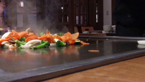 Hibachi teppanyaki style table food preparation in a Japanese steakhouse