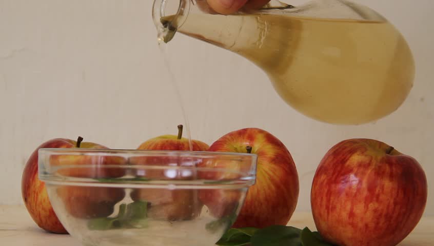 stream of apple cider vinegar falling from the bottle
 Royalty-Free Stock Footage #1012579991