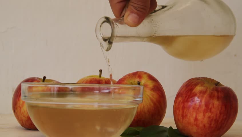 stream of apple cider vinegar falling from the bottle
 Royalty-Free Stock Footage #1012579994
