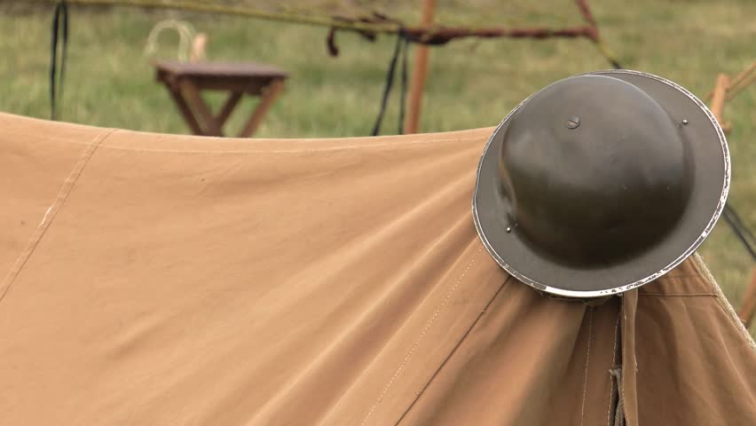 Military helmet on the battlefield. 4K, UHD, 50fps, Panning, Closeup 