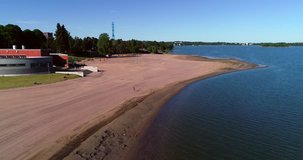City beach, C4k aerial view of Hietaranta beach, on a sunny summer morning dawn, in Hietaniemi, Helsinki, Uusimaa, Finland