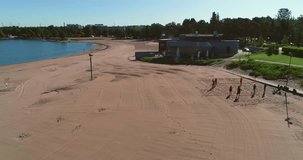 Empty beach, C4k aerial view of Hietaranta beach, on a sunny summer morning dawn, in Hietaniemi, Helsinki, Uusimaa, Finland