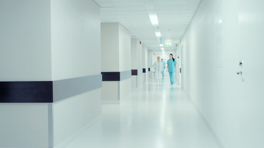 Time-Lapse of the Busy Hospital Corridor: Doctors, Nurses, Surgeons and Patients Walk through the Hallway of this Modern and Bright Clinic. Shot on RED EPIC-W 8K Helium Cinema Camera. | Shutterstock HD Video #1012593542