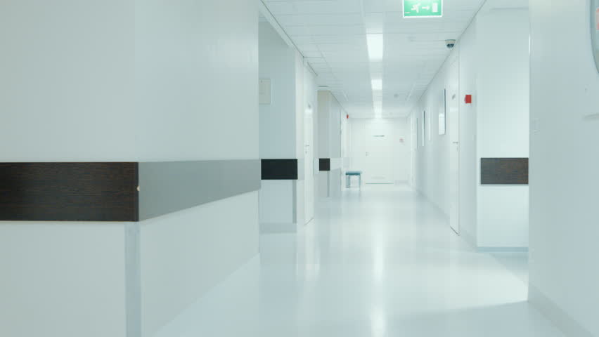 Team of Doctors, Surgeons and Nurses Walk Through Busy Hospital Hallway, They Talk about Patients, Forthcoming Surgeries and Saving Lives. Shot on RED EPIC-W 8K Helium Cinema Camera. Royalty-Free Stock Footage #1012593863