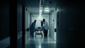 Emergency Department: Doctors, Nurses and Paramedics Run and Push Gurney with Seriously Injured Patient towards the Operating Room. Shot on RED EPIC-W 8K Helium Cinema Camera. - Powered by Shutterstock - Get 15% off with code: PIKWIZARD15