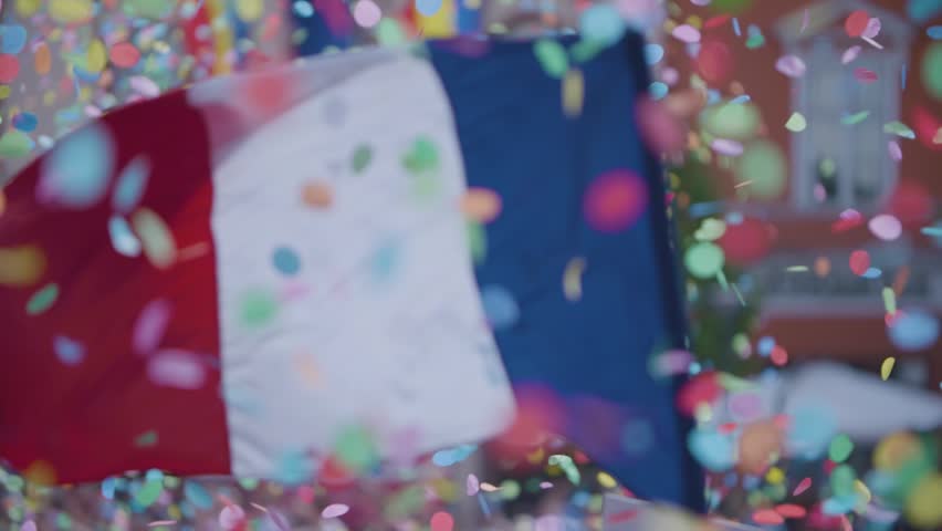 Floating confetti over a crowd of people. Waving the French flag in slow motion | Shutterstock HD Video #1012594943