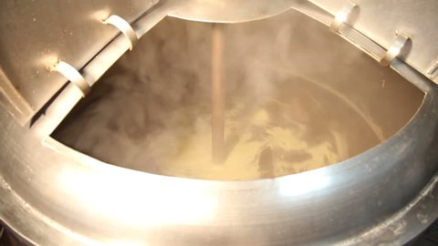 Brewing. Beer in the tank for brewing whirls in a whirlpool, mixed. The process of making beer.
