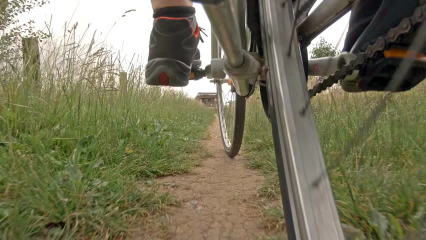 Man on road bike riding on path at Schwafheimer Meer, Moers Germany.