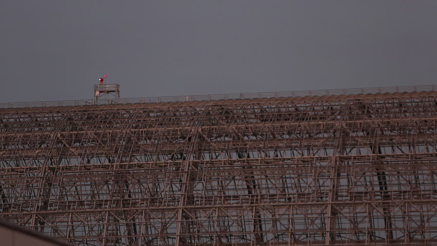 Mountainview, California / USA - February 4, 2013: Rotating light flashes on top of the skeleton remains of a Zeppelin Hangar