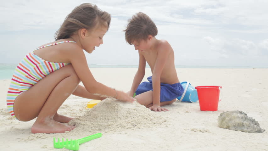Two Kids Playing with Sand Stock 