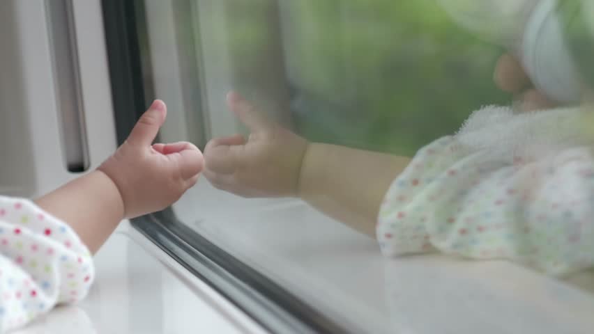 Little baby Traveling by Train. A One Years old Pointing her hand to Outside View, Sitting Near Wide Glass Window. Slow motion | Shutterstock HD Video #1012624418