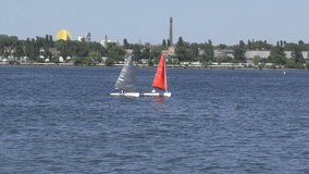 The sailboat sails along the Dnieper River