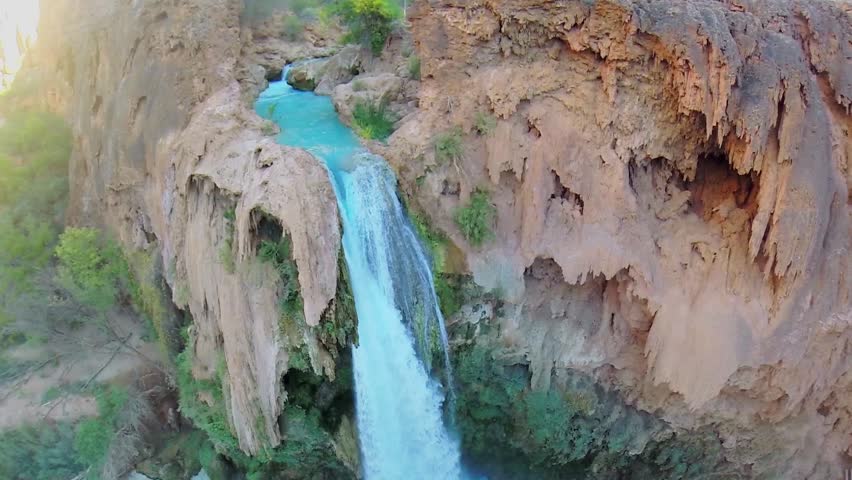 Havasu Falls on creek with small cave at autumn day in Grand Canyon. Aerial view