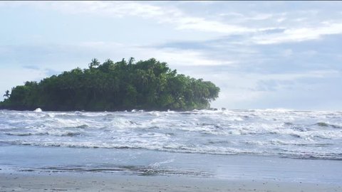 Dharmadam Island is an uninhabited island covered with coconut palms and dense bushes sits in Arabian sea at Malabar coasts Kerala India.