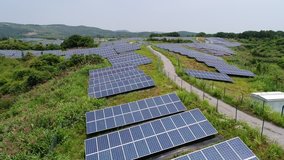 aerial video of new energy of solar power on hillside