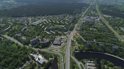 Riga city town living houses and building with roads and cars traffic Drone flight