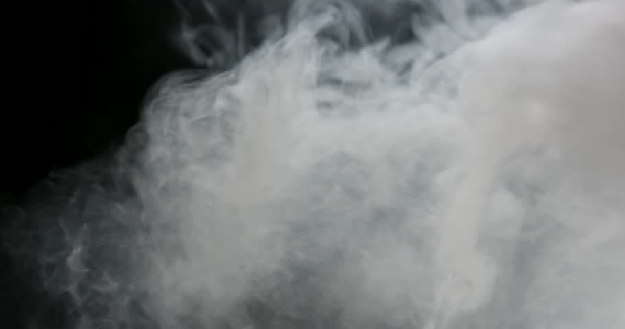 Heavy smoke from top of frame blown around as it settles
