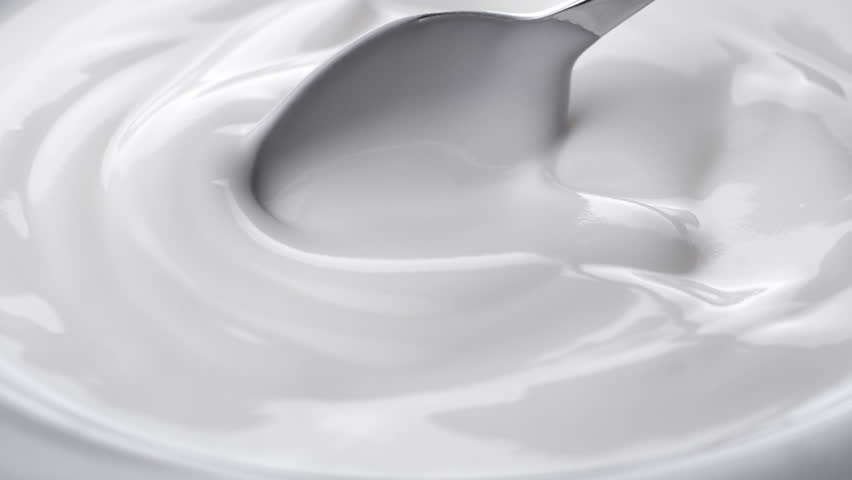Closeup shot of mixing yogurt with spoon, Rotating
 | Shutterstock HD Video #1012670081