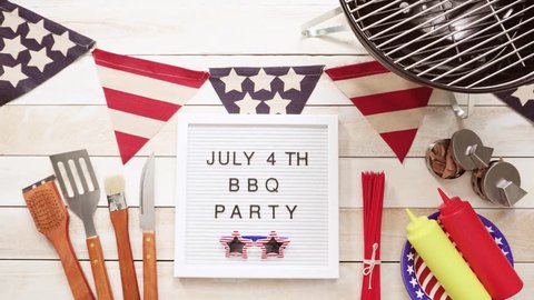 July 4th BBQ Party sign on memo board with July 4th decorations.