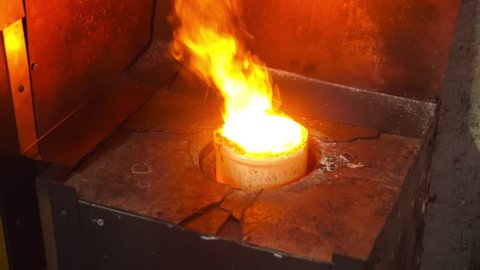 silver melting the hot stove in silver factory
hot jewel master in workshop. melt scrap rings