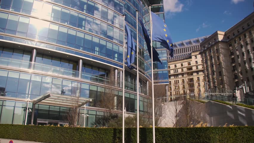 European Union building with waving European Flags Royalty-Free Stock Footage #1012680578