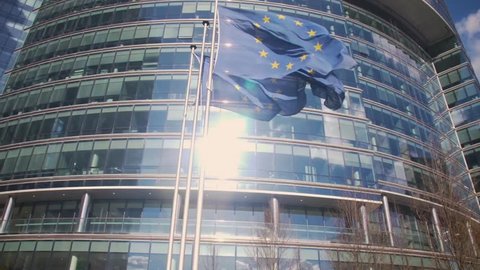 European Union building with waving European Flags