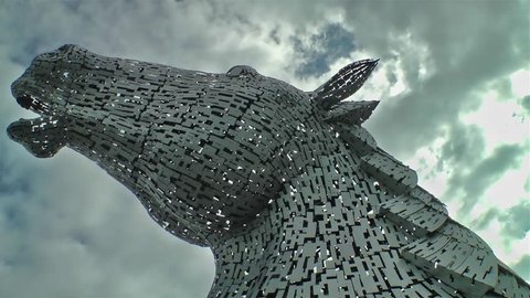 FALKIRK / SCOTLAND - JUNE 22 2018 - Thunder clouds moving above The Kelpies statue by Andy Scot, Helix park.