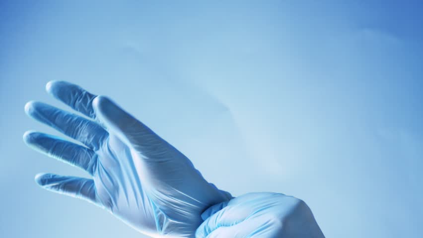 Doctor put on blue latex gloves, closeup Royalty-Free Stock Footage #1012688666