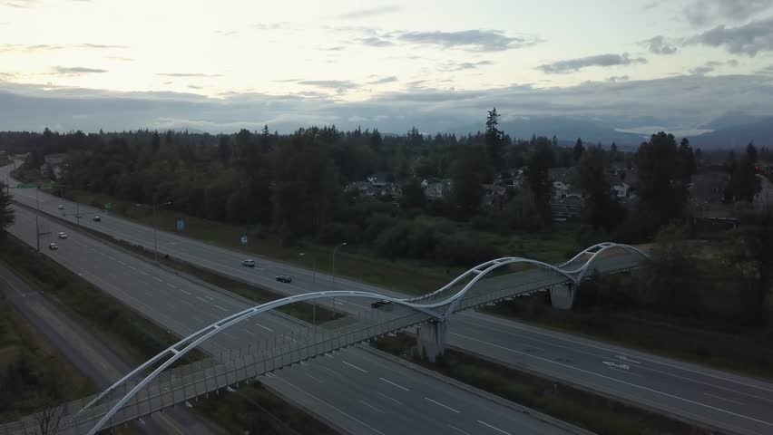 Aerial view of the Trans Canada Highway during a cloudy sunset. Taken in Surrey, Greater Vancouver, British Columbia, Canada.