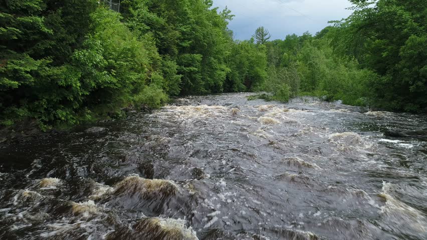 The river is raging through the forests of northern wisconsin