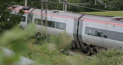 Hanslope, Buckinghamshire, England. June, 23, 2018. West Coast mainline train line, the UK's busiest line is used by Virgin Group and London Northwestern trains. 