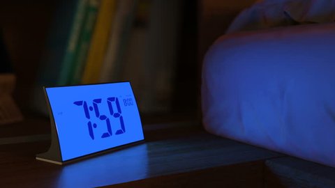 Digital alarm clock waking up at 8 AM. Close-up view. The numbers on the clock screen changes from 7:59 no 8:00 AM. Then alarm logo appears on the screen. 3D rendering animation.