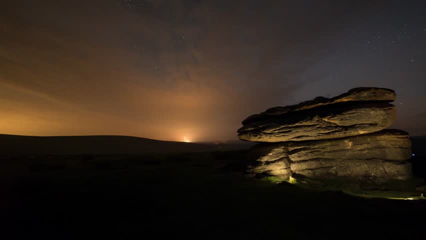 Clouds over Lit Granite Rock Formations Time Lapse at Night, Dartmoor National Park