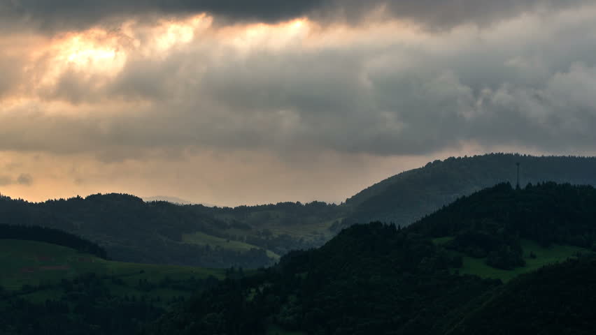 Dark clouds over forest mountains, Time lapse