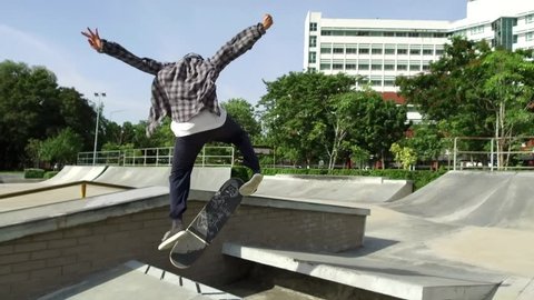 skateboarder doing a trick in a skate park, June 2018. Bangkok, Thailand. Stock Video